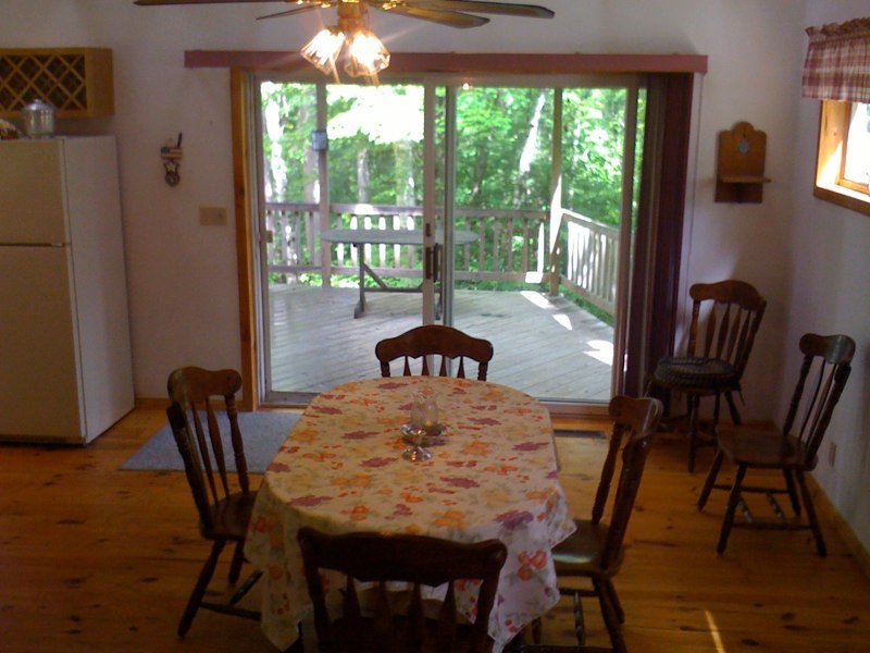 143-151 Rainbow Road Otis, MA 01029 - Photo 13 of 18 a dining room with furniture and wooden floor