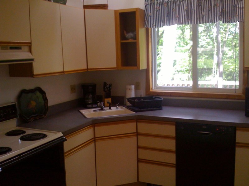 143-151 Rainbow Road Otis, MA 01029 - Photo 16 of 18 a kitchen with a sink cabinets and a window