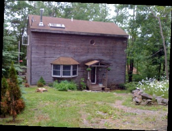 143-151 Rainbow Road Otis, MA 01029 - Photo 7 of 18 a brick building with a yard