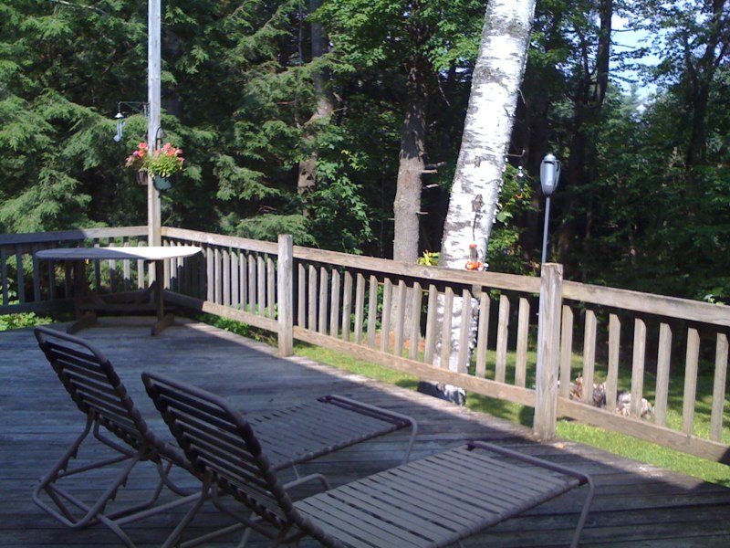 143-151 Rainbow Road Otis, MA 01029 - Photo 9 of 18 a view of balcony with wooden floor and outdoor seating
