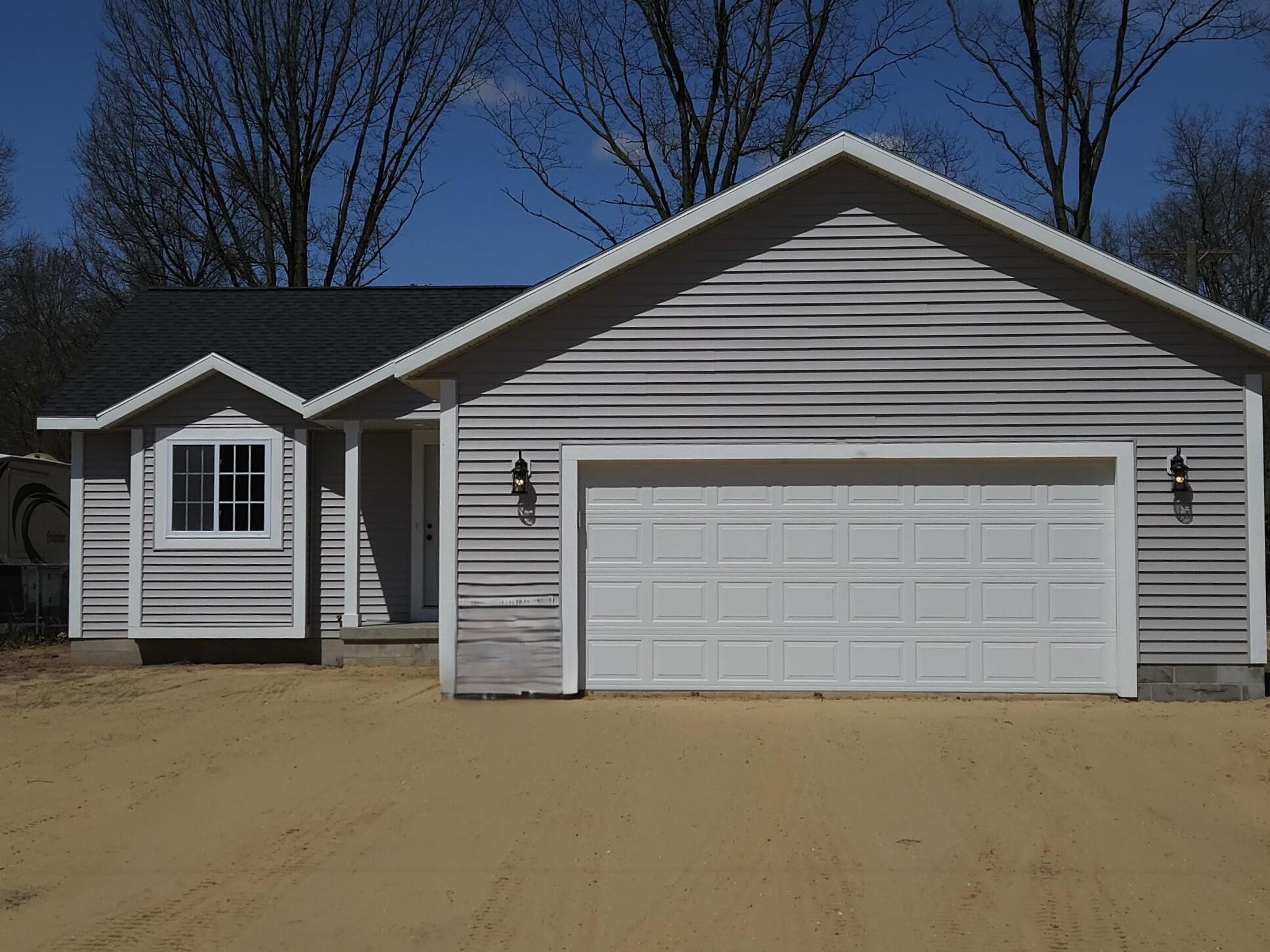 7445 Sweeter Road Twin Lake, MI 49457 - Photo 1 of 14 20250414_143645
