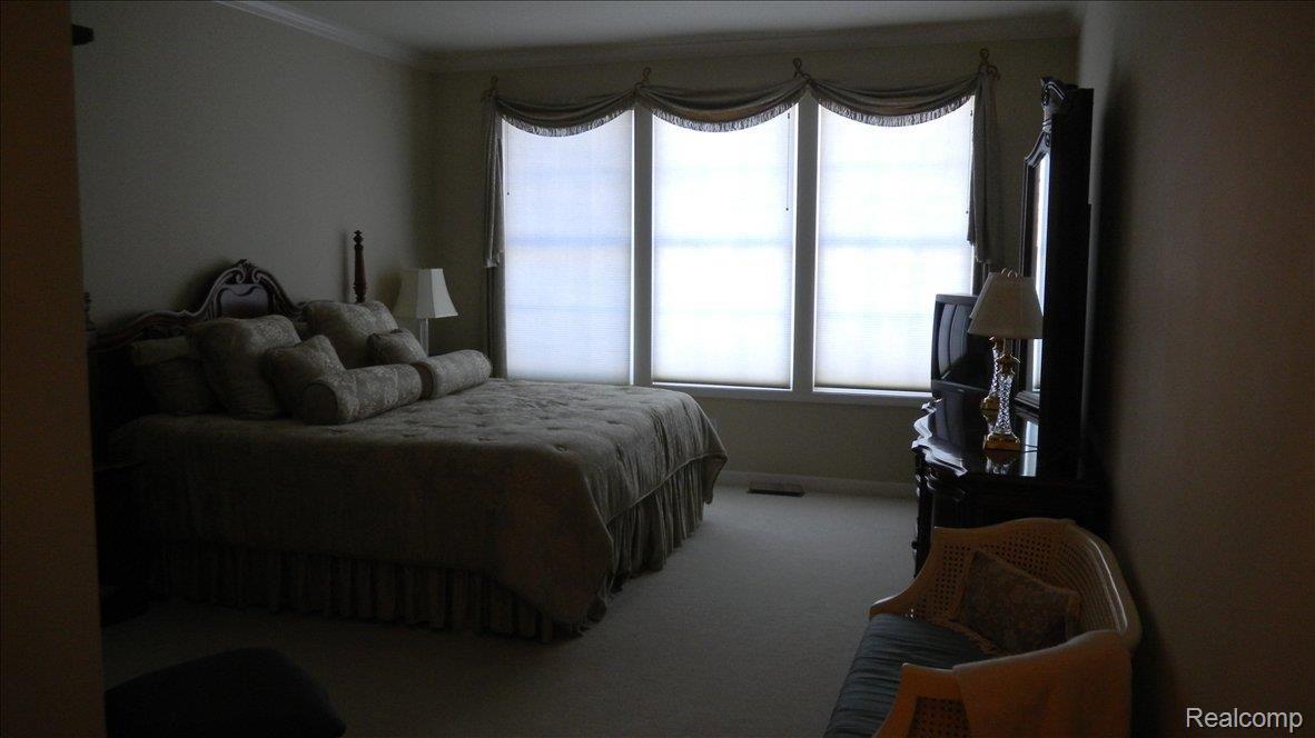 5043 Belmonte Drive, Unit 65 Rochester, MI 48306 - Photo 13 of 25 Master Bedroom