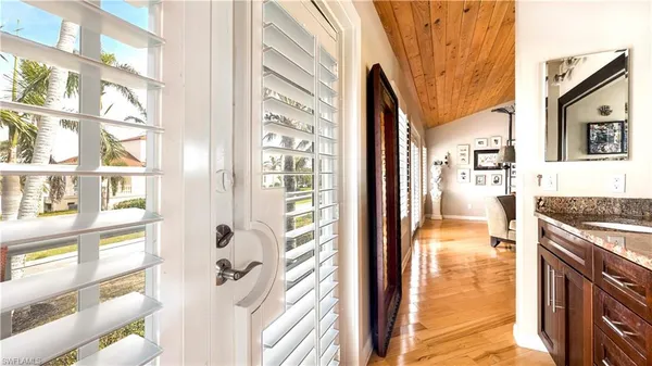 a en suite bathroom with a granite countertop shower and a sink