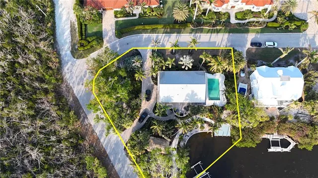 an aerial view of a house with a garden