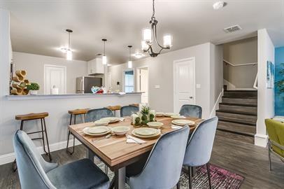 4016 Sheraton Road Denton, TX 76209 - Photo 13 of 35 a view of a dining room and livingroom with furniture