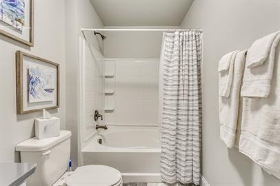 4016 Sheraton Road Denton, TX 76209 - Photo 31 of 35 a bathroom with a toilet sink and shower