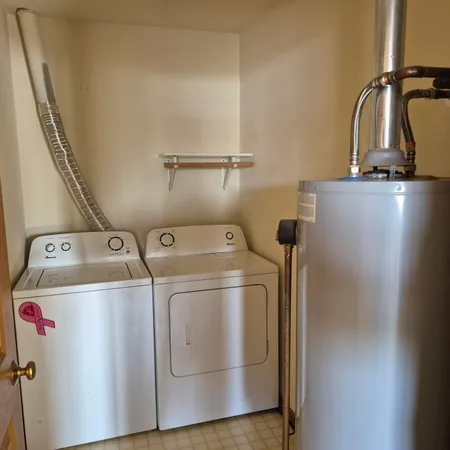 a white toilet next to a bathroom