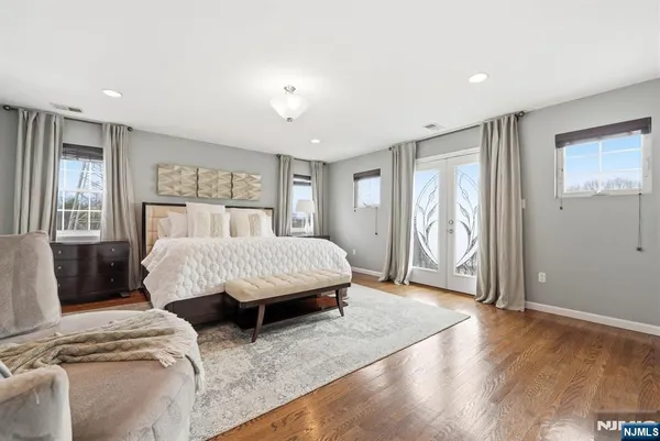 a spacious bedroom with a large bed and a window