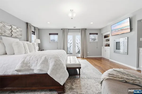 a bedroom with a large bed and a couch