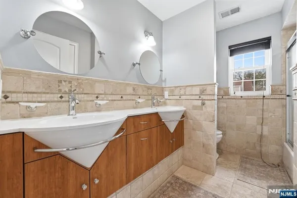 a bathroom with a sink and mirror