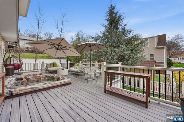 a view of a roof deck with wooden floor