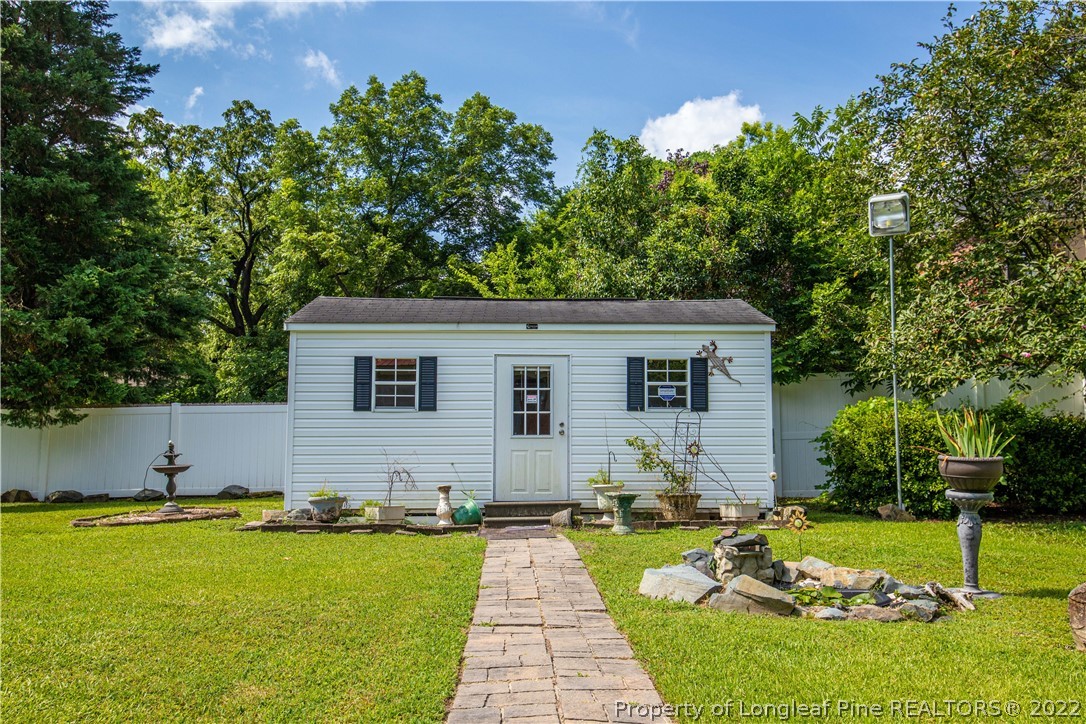 1913 Morganton Road Fayetteville, NC 28305 - Photo 16 of 45 a view of a house with a yard
