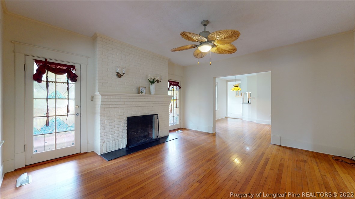 1913 Morganton Road Fayetteville, NC 28305 - Photo 20 of 45 a view of a livingroom with wooden floor and a fireplace