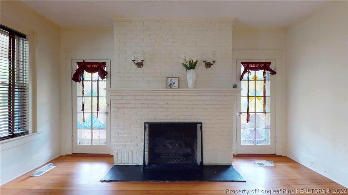 1913 Morganton Road Fayetteville, NC 28305 - Photo 21 of 45 a view of an empty room with wooden floor and a window