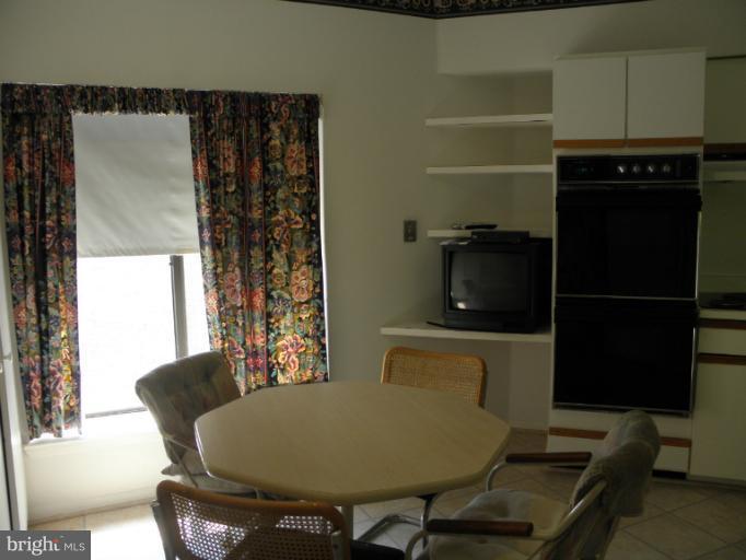 3031 Fallstaff Road, Unit 607C Baltimore, MD 21209 - Photo 13 of 14 a living room with furniture and a window