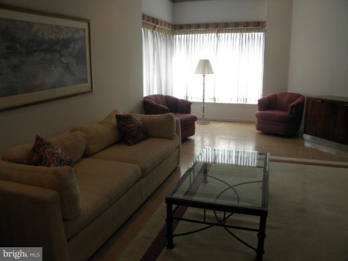 3031 Fallstaff Road, Unit 607C Baltimore, MD 21209 - Photo 7 of 14 a living room with furniture and a large window