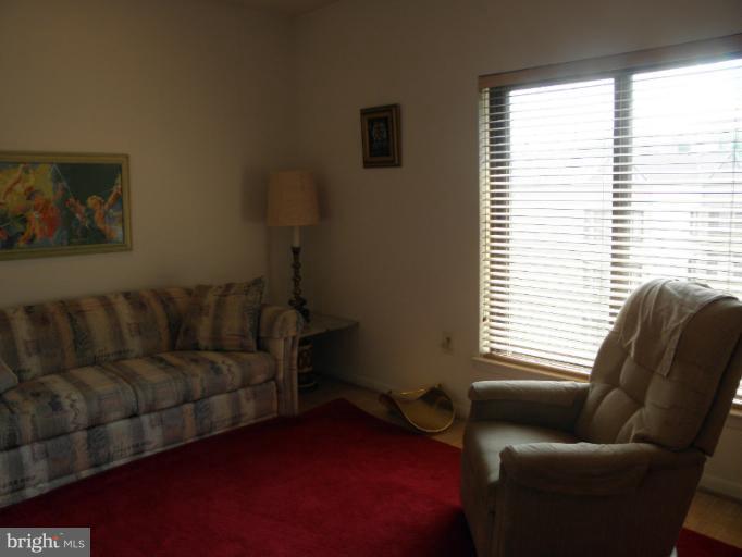 3031 Fallstaff Road, Unit 607C Baltimore, MD 21209 - Photo 9 of 14 a living room with furniture and a window