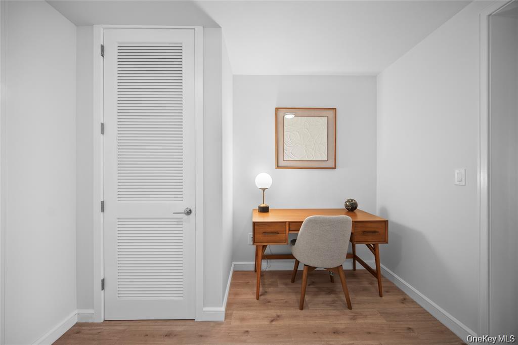 1 Renaissance Square, Unit 10G White Plains, NY 10601 - Photo 14 of 27 a view of a workspace with furniture and a window