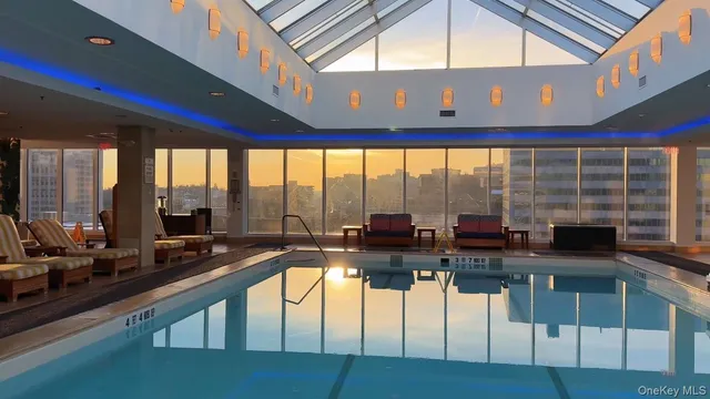 a room with gym equipment and floor to ceiling window