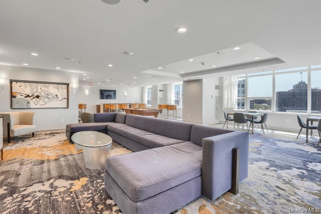 1 Renaissance Square, Unit 10G White Plains, NY 10601 - Photo 26 of 27 a living room with furniture and a view of kitchen