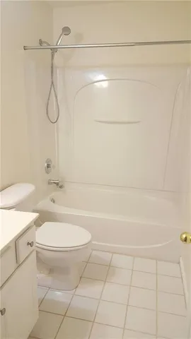 a bathroom with a toilet a sink and a shower