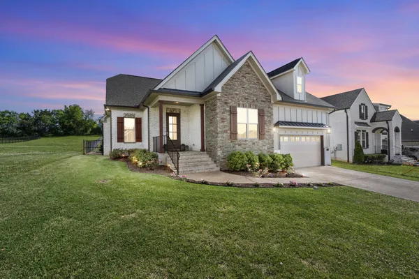 a front view of a house with a yard