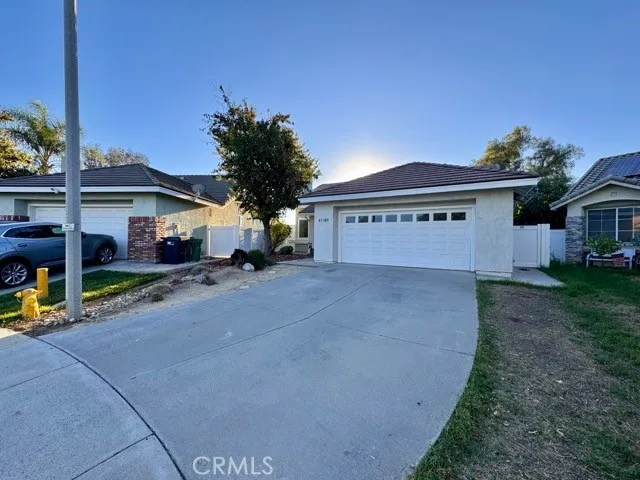 a view of house with outdoor space and sitting area