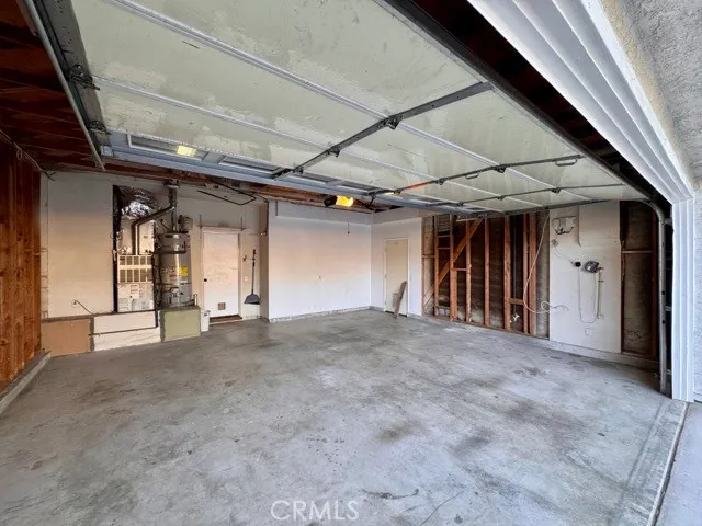 a view of a blue house with a yard