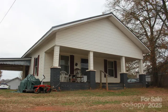 a backyard of a house with seating space
