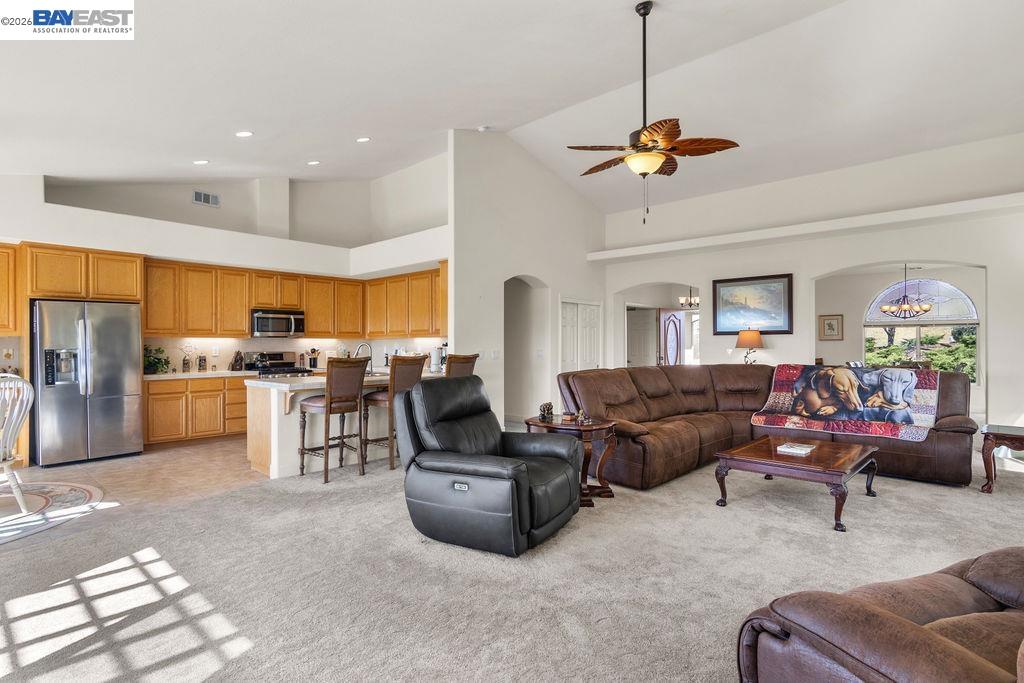 1105 Paradise Peak Road Valley Springs, CA 95252 - Photo 13 of 52 a living room with furniture kitchen view and a chandelier