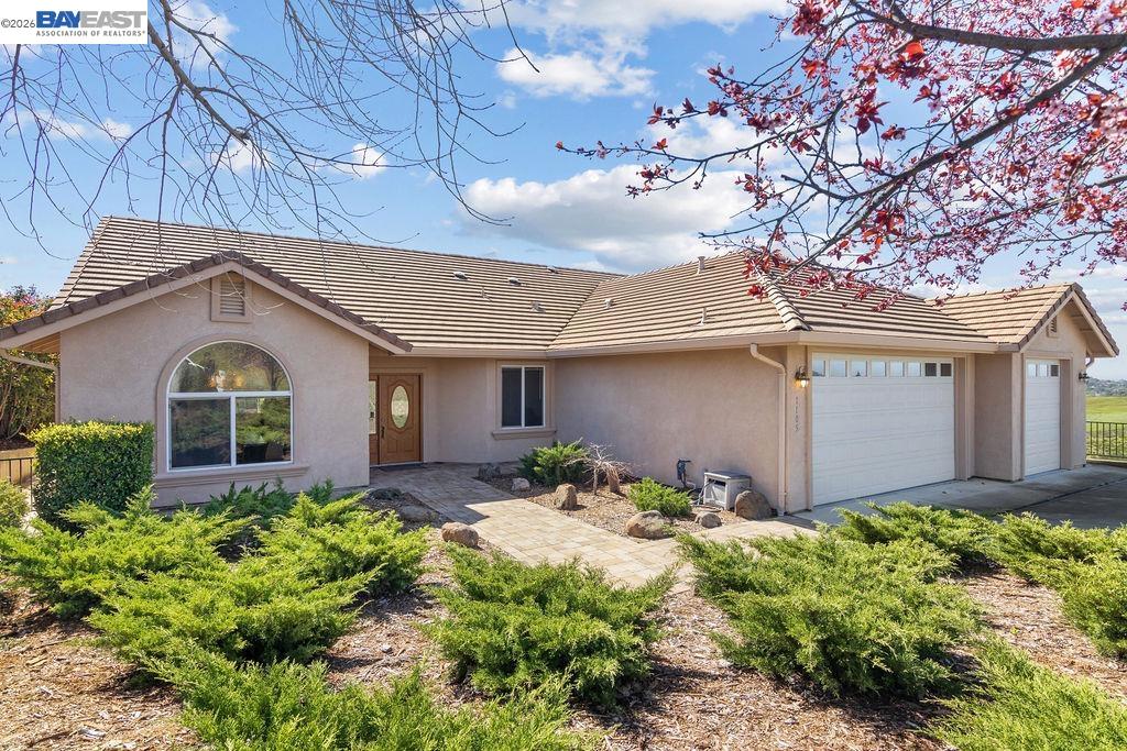 1105 Paradise Peak Road Valley Springs, CA 95252 - Photo 2 of 52 a front view of house with yard and trees in the background