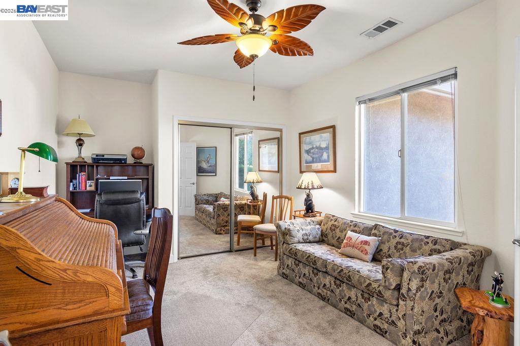 1105 Paradise Peak Road Valley Springs, CA 95252 - Photo 21 of 52 a living room with furniture and a chandelier
