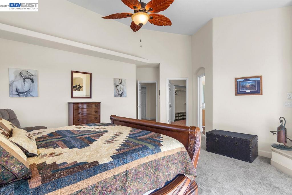 1105 Paradise Peak Road Valley Springs, CA 95252 - Photo 32 of 52 a bedroom with a bed and a chandelier