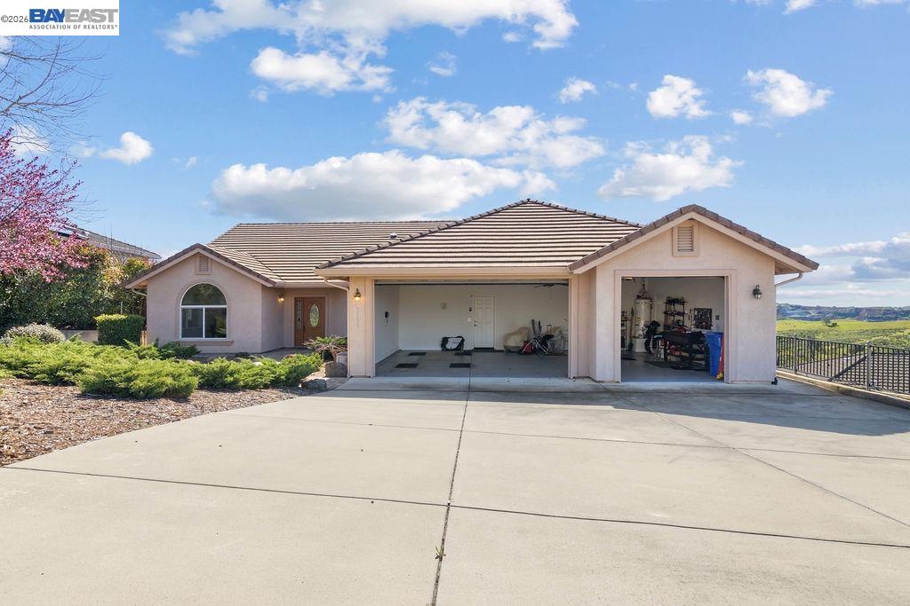 1105 Paradise Peak Road Valley Springs, CA 95252 - Photo 4 of 52 a front view of a house with a porch and a yard