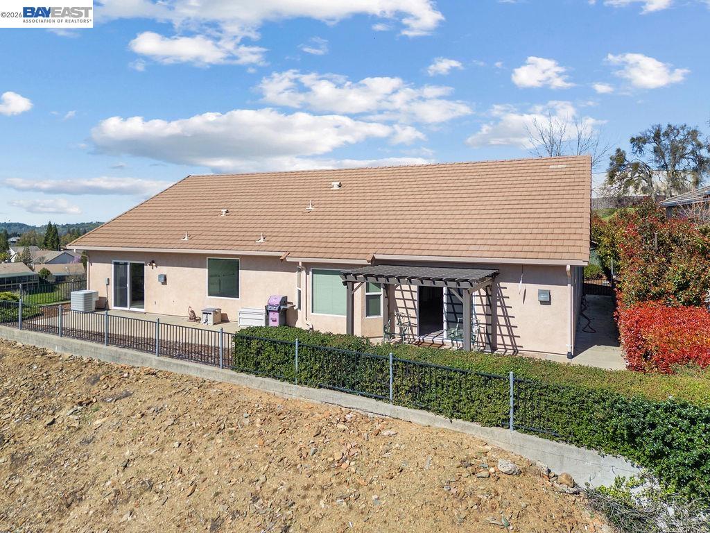 1105 Paradise Peak Road Valley Springs, CA 95252 - Photo 45 of 52 a view of a house with a yard and potted plants