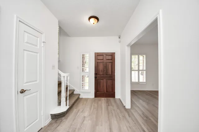 a view of entryway with wooden floor