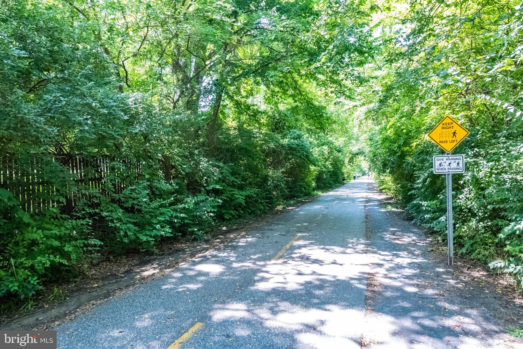 7036 Strathmore Street, Unit 311 Chevy Chase, MD 20815 - Photo 17 of 27 a view of a street with a yard