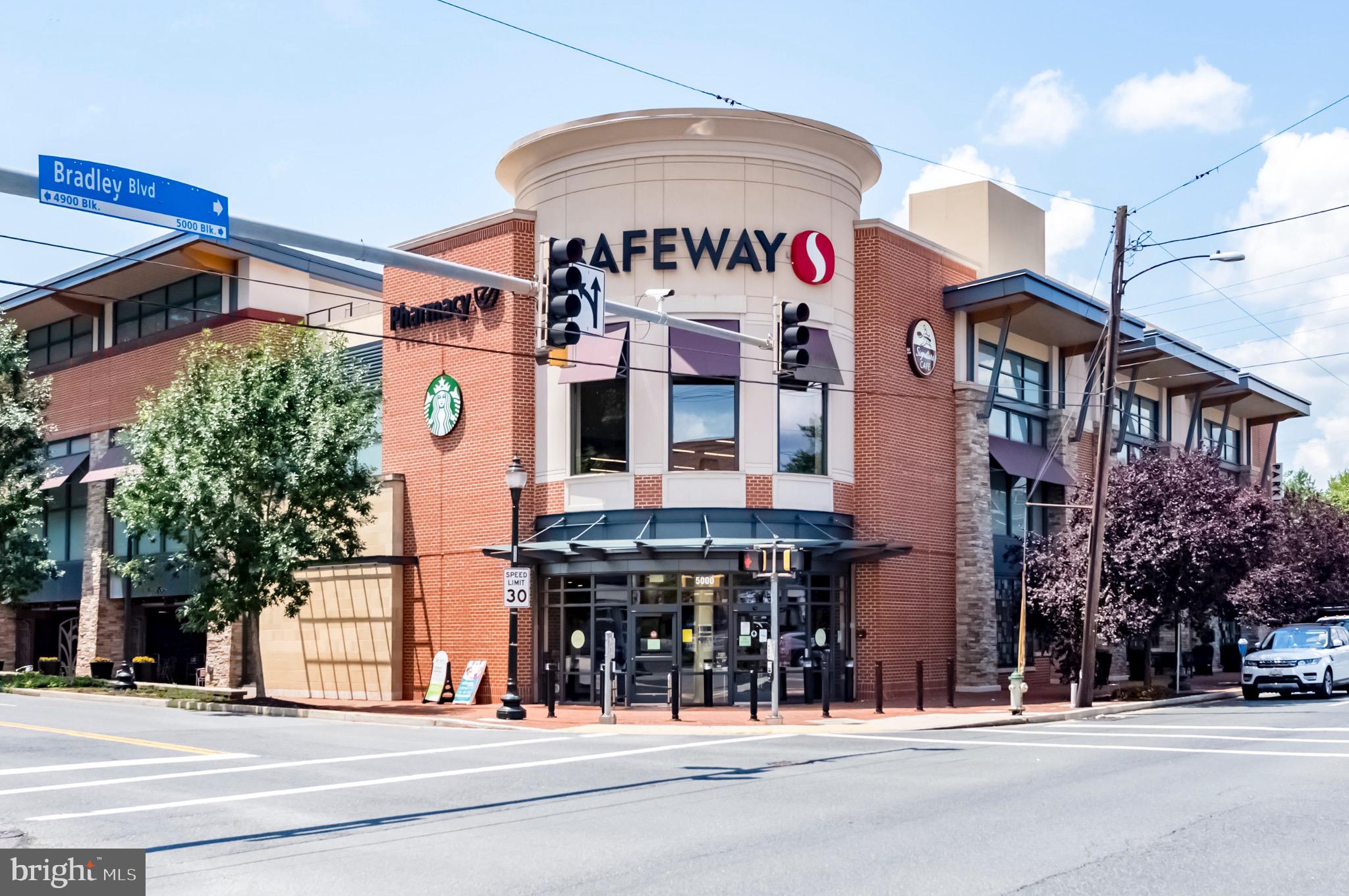 7036 Strathmore Street, Unit 311 Chevy Chase, MD 20815 - Photo 22 of 27 a front view of a building with street