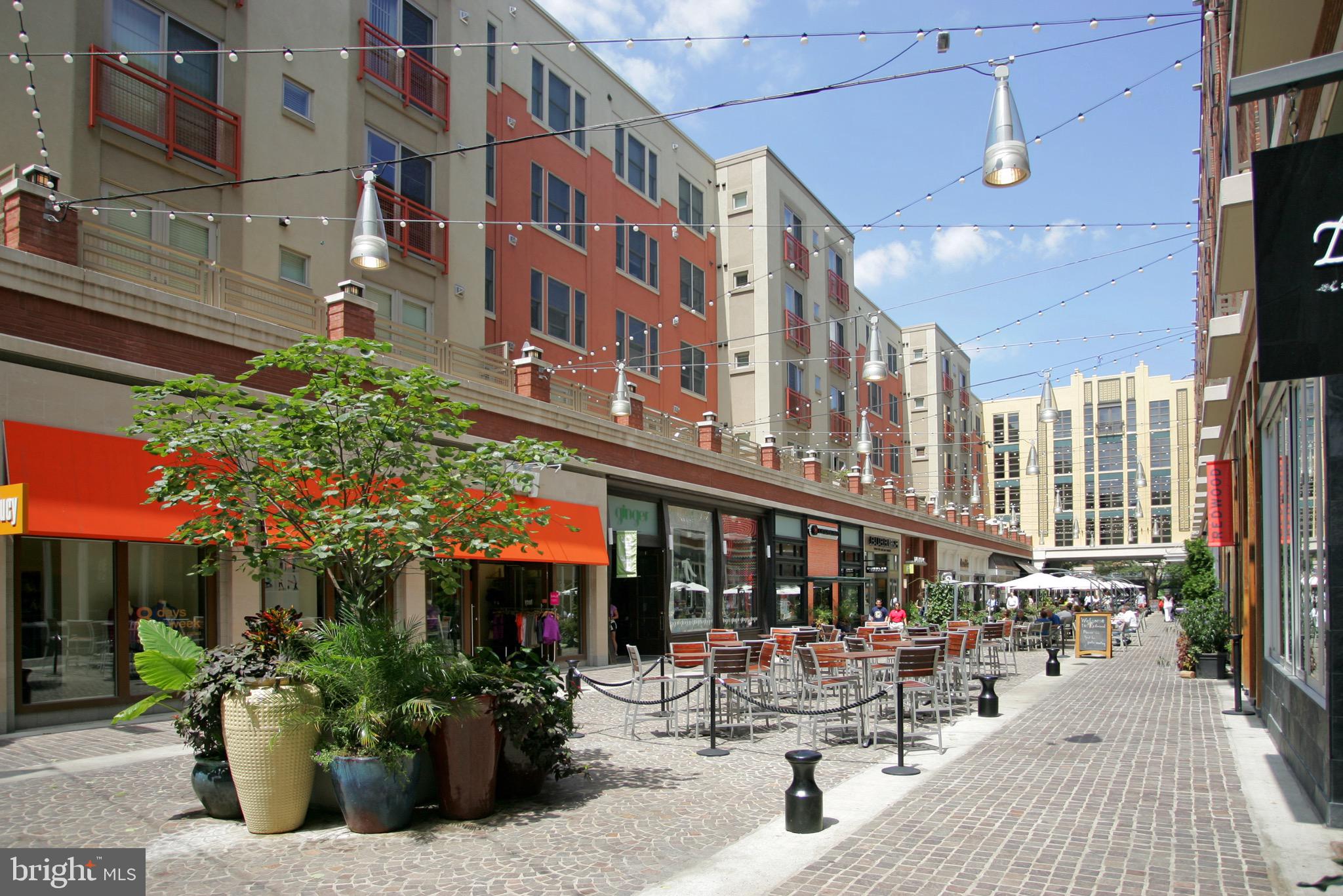 7036 Strathmore Street, Unit 311 Chevy Chase, MD 20815 - Photo 24 of 27 a view of a building with sitting area