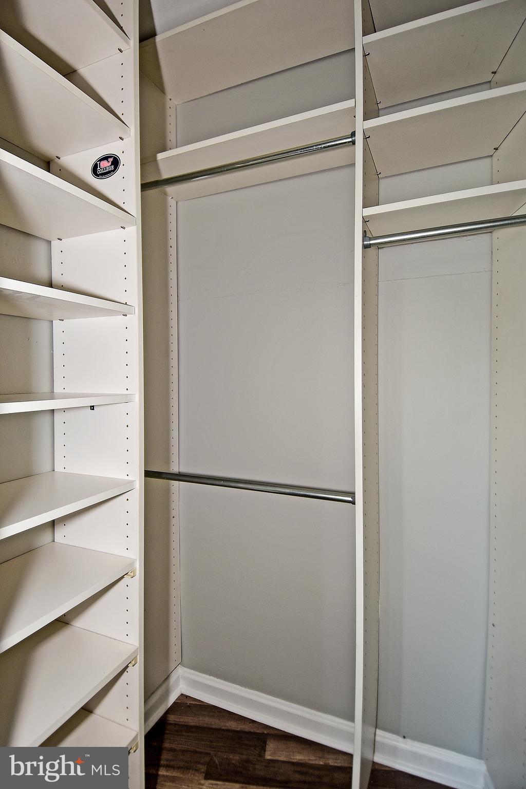 7036 Strathmore Street, Unit 311 Chevy Chase, MD 20815 - Photo 5 of 27 a view of walk in closet with empty racks