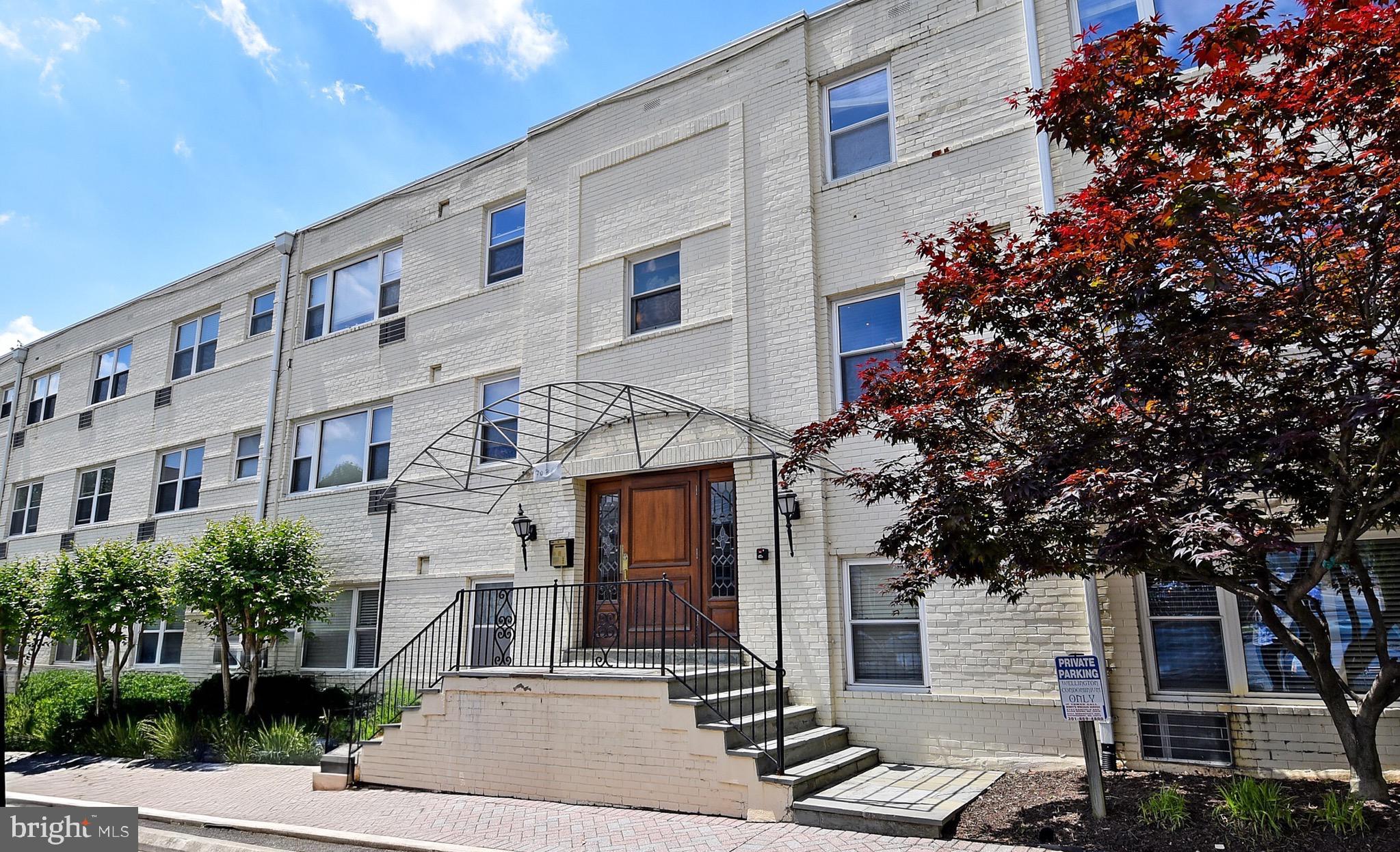 7036 Strathmore Street, Unit 311 Chevy Chase, MD 20815 - Photo 9 of 27 a front view of a building with street view