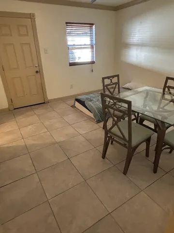 a room with a table and chairs