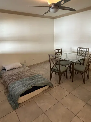 a view of a livingroom with furniture and hardwood floor