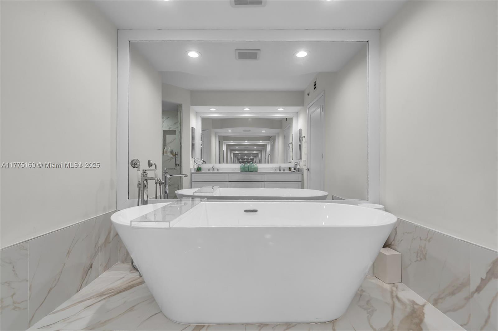 765 Crandon Boulevard, Unit 202 Key Biscayne, FL 33149 - Photo 14 of 41 a view of a bathtub in a bathroom