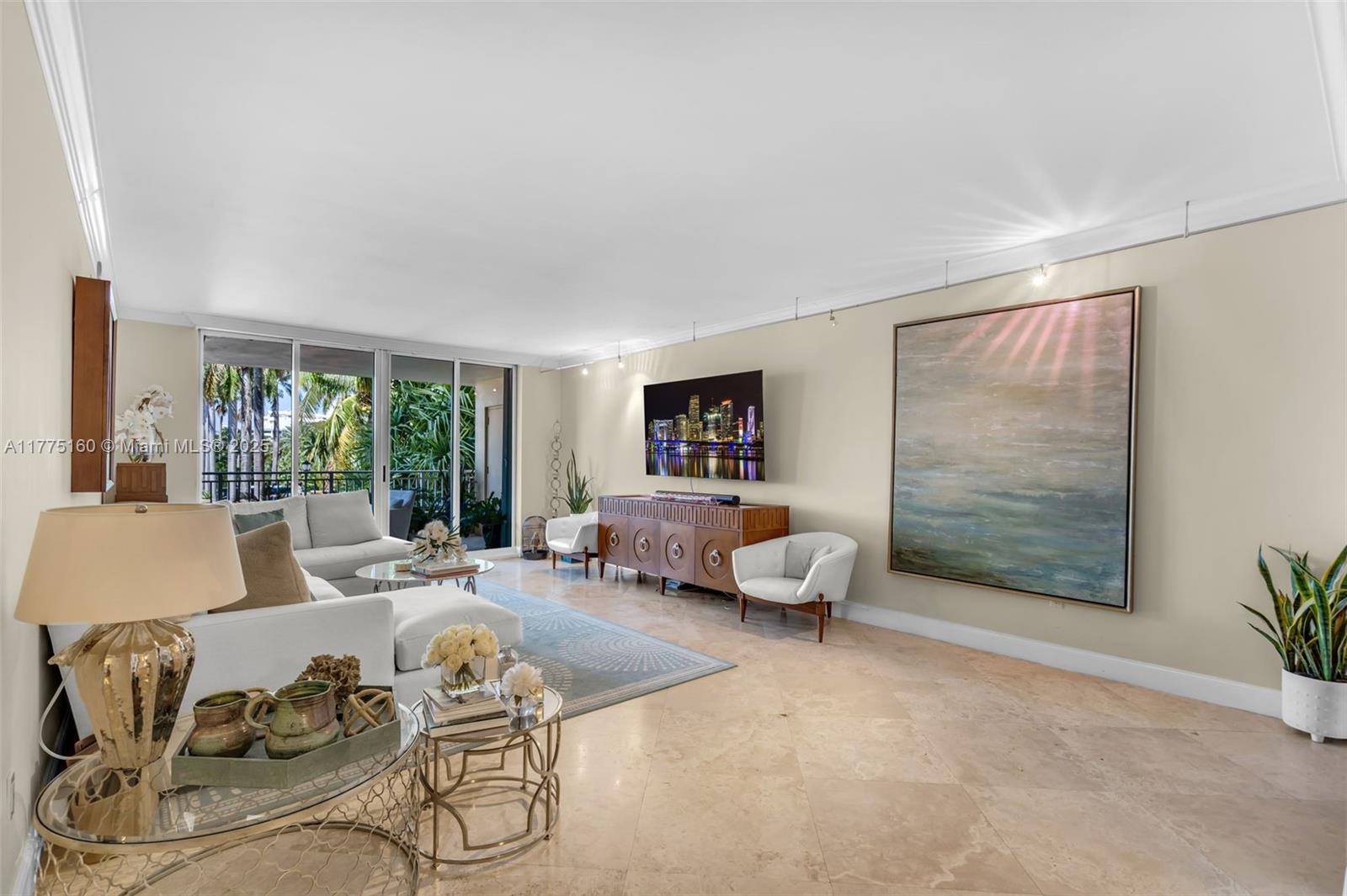765 Crandon Boulevard, Unit 202 Key Biscayne, FL 33149 - Photo 2 of 41 a living room with furniture and a large window