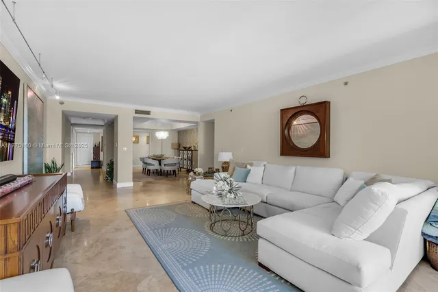 a living room with furniture and a mirror