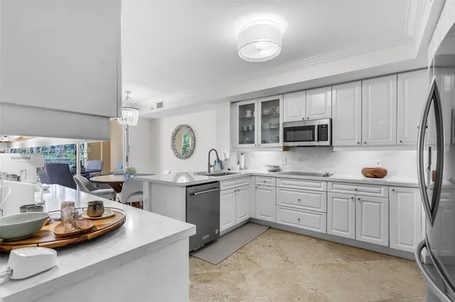 a kitchen with sink cabinets and window