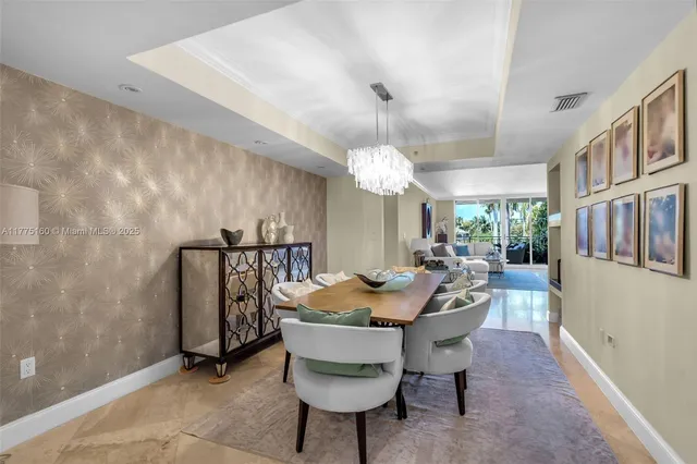 a view of a dining room that has a table and chairs