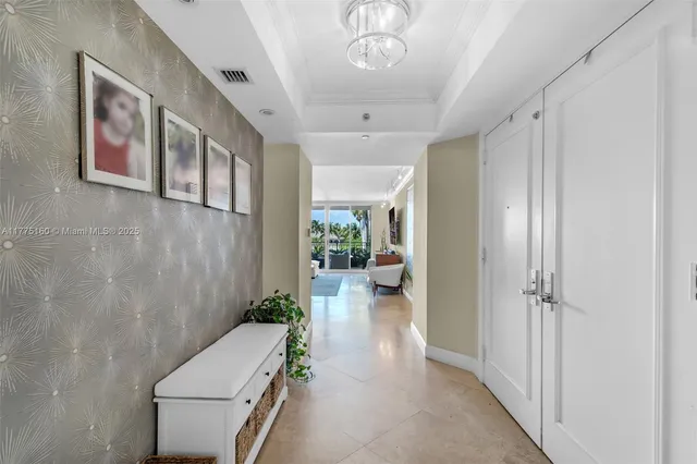 a bedroom with a bed window with table and chairs