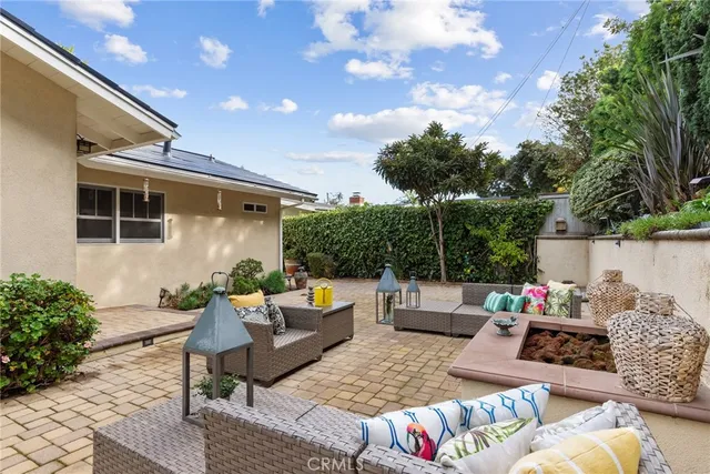 a outdoor living space with furniture and a fireplace